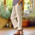 Locker sitzende Leinen-Hose mit seitlichen Knöpfen und hohem Bund für Damen, lässig. - S / Aprikose