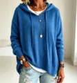 Detail view of the casual loose hooded drawstring knit sweater, showing cozy texture and styling. - S / Blue
