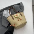 Woven straw bucket bag for women, cute plush flower decor, brown PU handles, summer beach handbag. - Brown