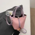 Stylish pink and purple soft leather bucket bag with metallic lock and dual top handles - No Pendant / Purple