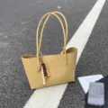 Stylish yellow woven tote bag for women, large capacity commuter shoulder bag with charms. - With Charm / Yellow
