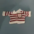 Close-up of red white striped doll sweater, cute bear badge and cozy knit texture. - Red and White Striped Sweater