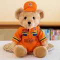 Cute firefighter teddy bear plush toy wearing orange uniform, soft stuffed doll gift for kids. - Brown Firefighter Bear