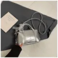 Silver metallic pillow handbag with lace ribbon decor, stylish shoulder messenger bag for women. - No Pendant / Silver