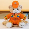 Plush teddy bear toy in orange police and firefighter uniform with cap and belt variant. - Brown Rabbit Fur Firefighter Teddy Bear