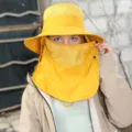 Yellow sun protection bucket hat with face shield and neck flap for outdoor UV block hiking. - Turmeric