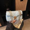 Light blue quilted shoulder bag with gold chain strap, stylish chic crossbody bag variant. - Blue