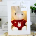 Cute plush rabbit toy in white gift bag with red sweater and warm lights for kids gift - White Rabbit in Red Clothes Gift Box / 30cm
