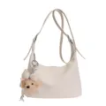 Trendy casual off-white shoulder dumpling bag with cute bow plush pendant for women use daily - With Charm / White