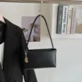 Minimalist black baguette shoulder bag, versatile casual underarm bag for women daily wear. - With Pendant / Black