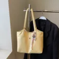 Large capacity women's yellow tote bag, stylish PU leather shoulder bag for daily commuting. - With Pendant / Yellow