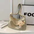 Beige leather hobo shoulder bag with cute plush charm, stylish dumpling crossbody bag. - With Pendant / Off White