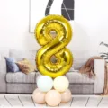 Gold 32-inch number 8 foil balloon with pastel balloon base for birthday party decor. - Number 8 / Gold