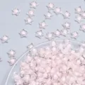 Nahaufnahme transparenter Acrylsternperlen mit rosafarbenem Kern für DIY-Bastelarbeiten. - 12 mm AB / Rosa