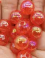 Close-up detail of vibrant orange cracked acrylic bubble beads with AB rainbow iridescent coating. - 8mm Approx. 1750 Pcs / Red