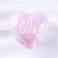 Close-up detail of the glossy iridescent pink heart bead charm with embossed love text. - Heart / Pink