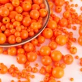Vibrant orange acrylic round beads with smooth surface for DIY jewelry making and crafting. - 10mm Approx. 920 Pcs / Fluorescent Orange