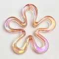 Detailed close-up of iridescent UV plated hollow flower bead for unique handmade DIY crafts. - Orange