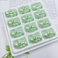 Grüne Acryl Wolken Perlen Detailaufnahme, Seide Perle Textur DIY Handgemachte Anhänger. - Grün