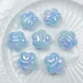 Close up of light blue iridescent acrylic plum blossom beads, perfect for DIY jewelry. - 19mm / 6# Blue Marble