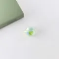 Close-up of iridescent faceted acrylic bead detailing unique multi-color reflection texture. - 6# Green