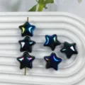 Detailed close-up view of shiny iridescent star acrylic beads displayed on white tray. - 10# Black