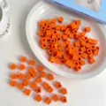 Detailed view of orange acrylic square alphabet beads designed for DIY jewelry making. - SS2136 Korean Golden Yellow