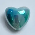 Close-up detail of iridescent gradient heart-shaped bead, perfect for DIY jewelry crafting. - Blue