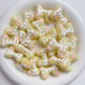 Acrylic bow beads with sweet icing drip design, perfect for cute DIY phone charms and accessories. - Yellow And White