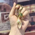 Iridescent acrylic conch keychain cute colorful shell bag charm and car pendant. - S / Yellow