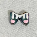 Rainbow dripping bow charm bead variant for DIY phone strap, keychain and jewelry making accessories. - Black and White