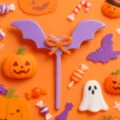 Halloween acrylic bat cake topper detailed view with cute pumpkin and ghost decorations. - Purple Bat with Orange Bow