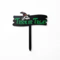 Halloween black acrylic cake topper detail showing the spooky skull and green text design. - Skull Trick or Treat / Width Approx 9CM