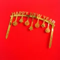 Gold acrylic Happy New Year cake topper, arched design with hanging ornaments, detail view. - Gold New Year Arch