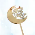 Detailed view of gold mirror acrylic cake topper featuring crescent moon and stars pattern. - Single Moon Sign Topper