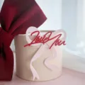 Close-up detail of romantic Valentine's Day acrylic cake topper with red love bow decor. - Pink Love You Bow Style / 9x11.5cm (1.3mm Thickness)