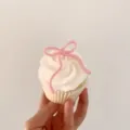 Closeup of a pink acrylic bow cake topper, perfect for birthday and party baking decoration. - Single Insert / Width Approx 5CM / Pink