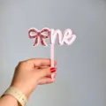 Pink acrylic one cake topper with glitter bow design for baby birthday party cake decoration. - Double Layer Bow 'One' (Style-01) / Pink and White