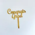 Gold acrylic Congrats Grad cake topper for graduation party celebrations and dessert decor. - 2026 Graduation Cake Topper 4 / 1 Piece / Gold