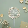 Mother's Day acrylic cake topper with floral wreath design, white and gold party decor. - Lily Wreath Printed Happy Mother's Day MOM / Width Approx 10CM (1.3MM Thickness) / White with Gold