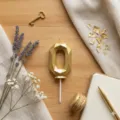 Gold geometric number 0 candle detail shot, perfect for birthday cake decoration and party styling. - Number 0 / Height Approx 10.5cm / Gold