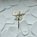 Gold acrylic hello 50 cake topper detail view, stylish party decoration for birthday celebration. - HELLO 50