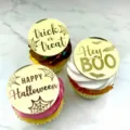 Close-up detail of gold acrylic Halloween cupcake toppers with festive text and designs on marble. - Gold Round Engraved (3 Piece Set) / 3 Pieces/Pack / Gold