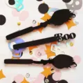Halloween black acrylic hair clips set featuring broom and BOO spooky designs for party. - Popsicle Sticks 3-Piece Set