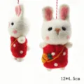 Detailed view of handmade wool felt rabbit pendant with red polka dot dress and cute carrot bag. - Red Rabbit
