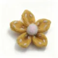 Handmade felt flower puff accessory with white stitching, cute DIY clothing and bag decor. - Turmeric