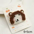 Cute cartoon animal wool felt brooch and hair clip detail showing cute design and size. - White Bear