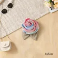 Detailed shot of fabric mesh rose flower accessory with gradient colors and leaves, exquisite design. - Rose Pattern in Pink