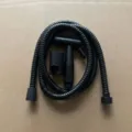 Black plastic bidet sprayer set detail shot, showing handheld nozzle, hose and holder. - Type B Spray Gun with Hose & Bracket (Transparent Bag) - Black