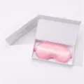 Pink silk eye mask in gift box for sleep, office lunch break, and travel. Detail view. - Gift Box / Pink